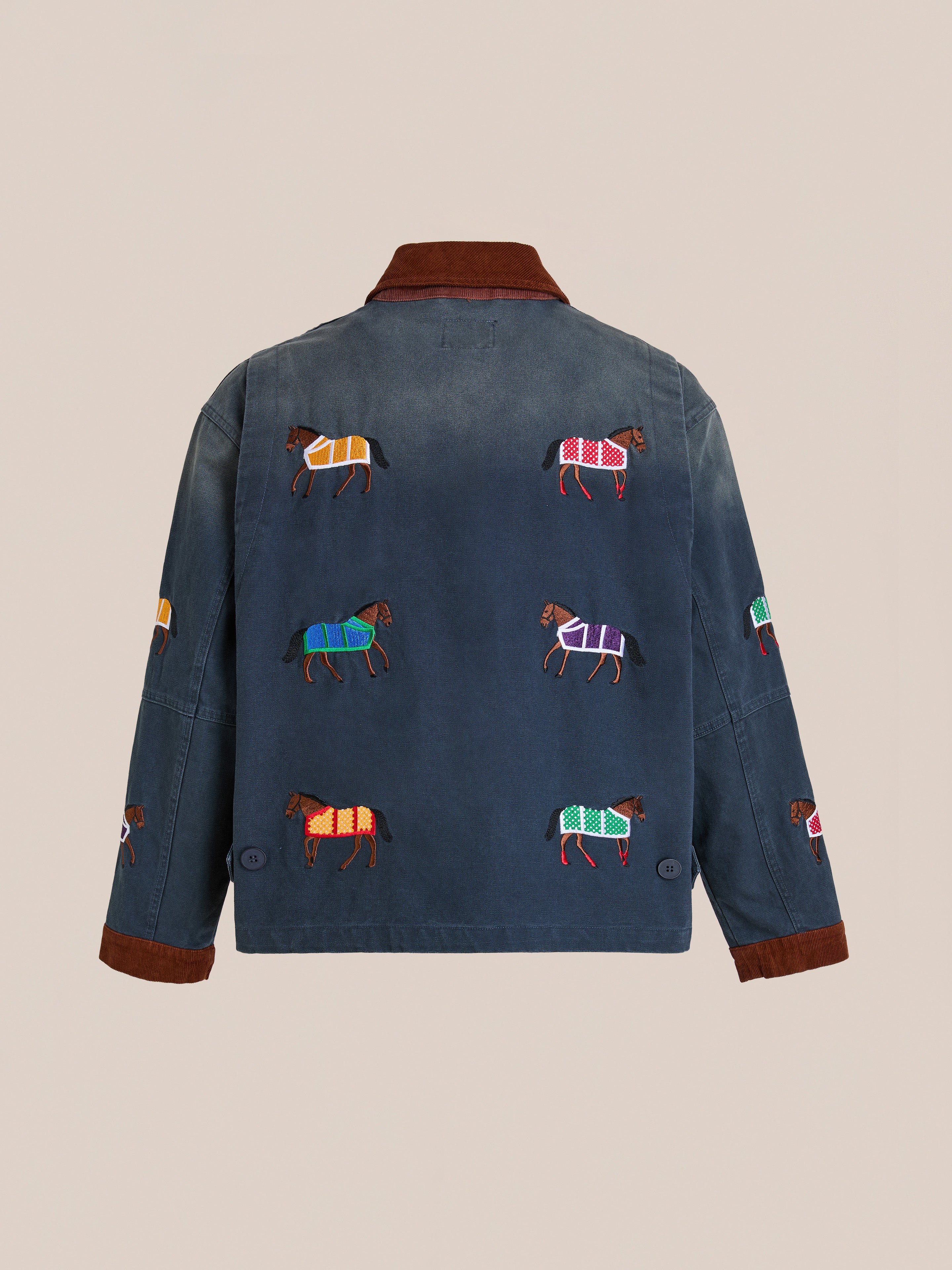The Found Lariat Horse Embroidered Work Jacket is a unisex navy jacket with a brown collar and cuffs, featuring colorful embroidered horses on the back and sleeves.