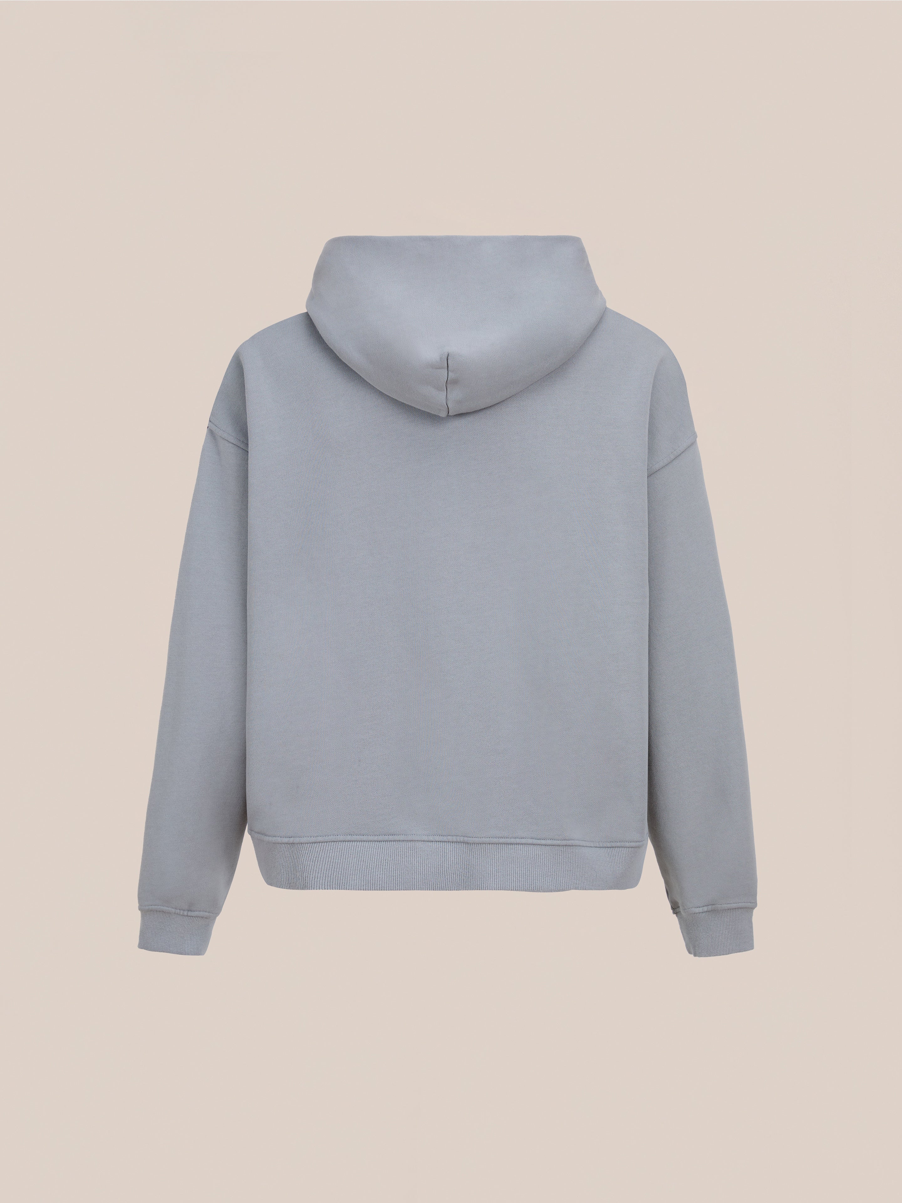 Back view of the FOUND Logo Patch Hoodie in washed gray, featuring a unisex relaxed fit, shown against a neutral background.