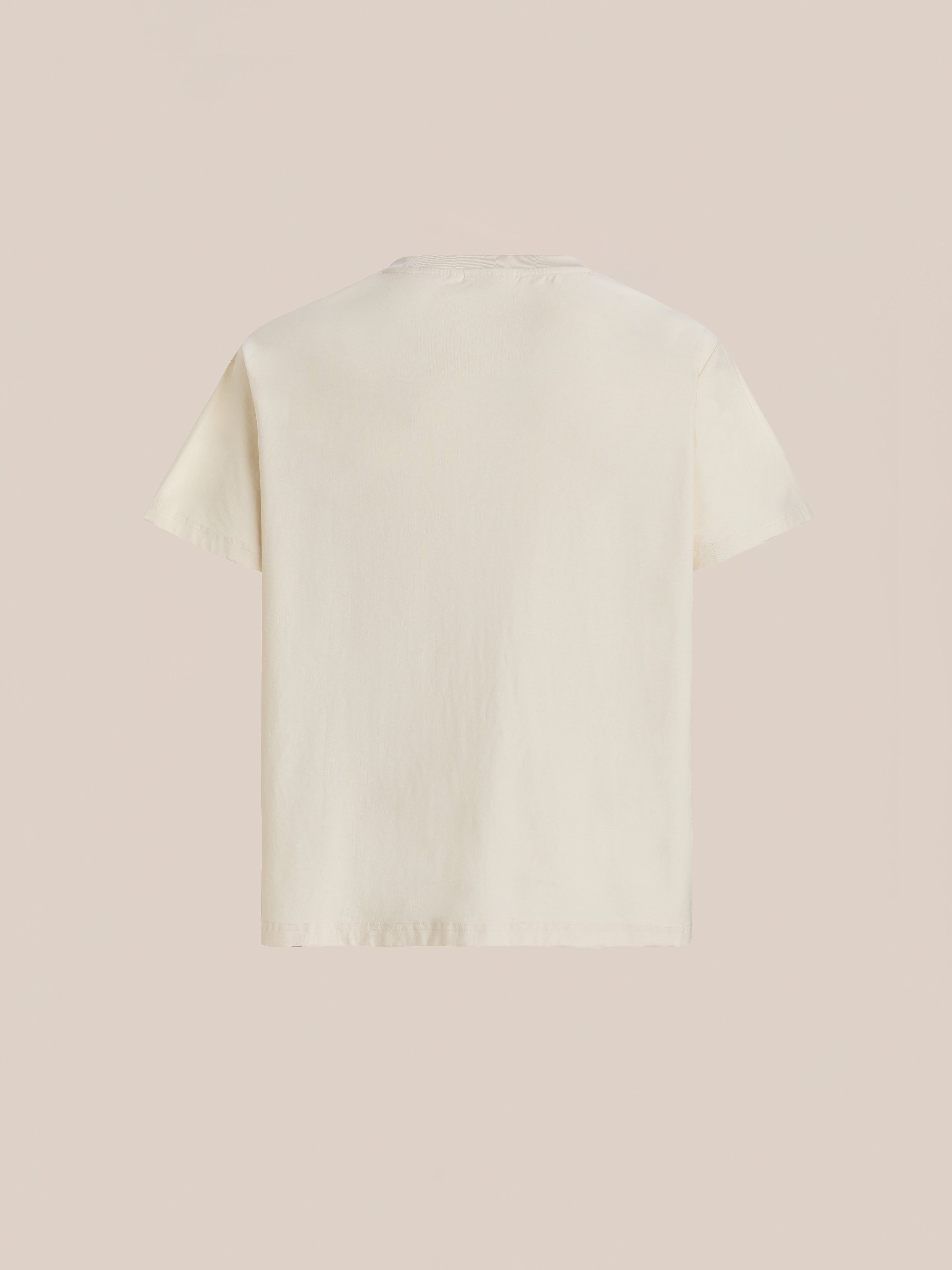 The FOUND One Humanity Tee, a plain white unisex relaxed fit short-sleeve t-shirt, is displayed from the back against a light beige background.