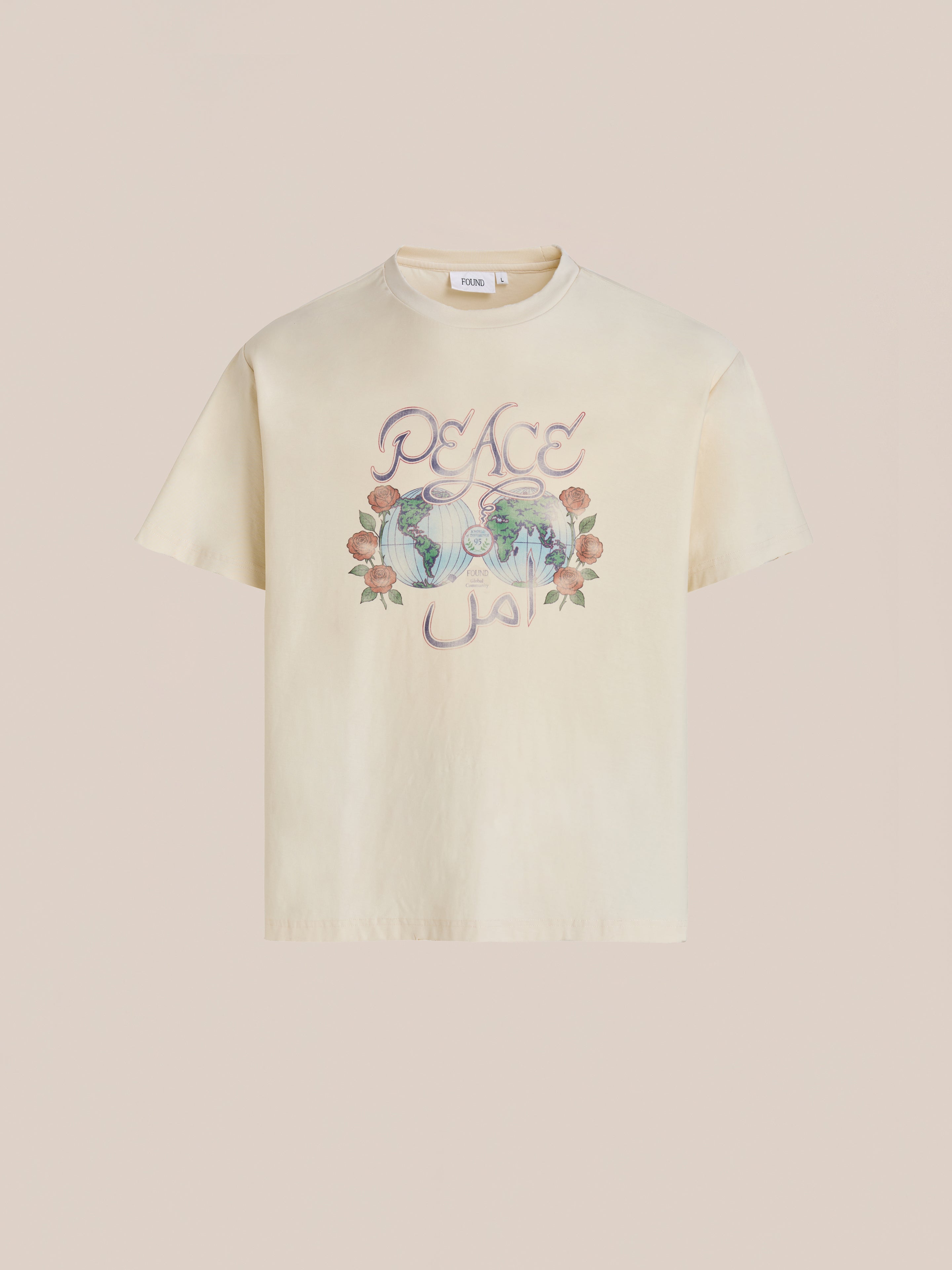 The FOUND Peace Globe Tee is a white vintage cotton shirt with a floral graphic and a unisex relaxed fit for all-day comfort.
