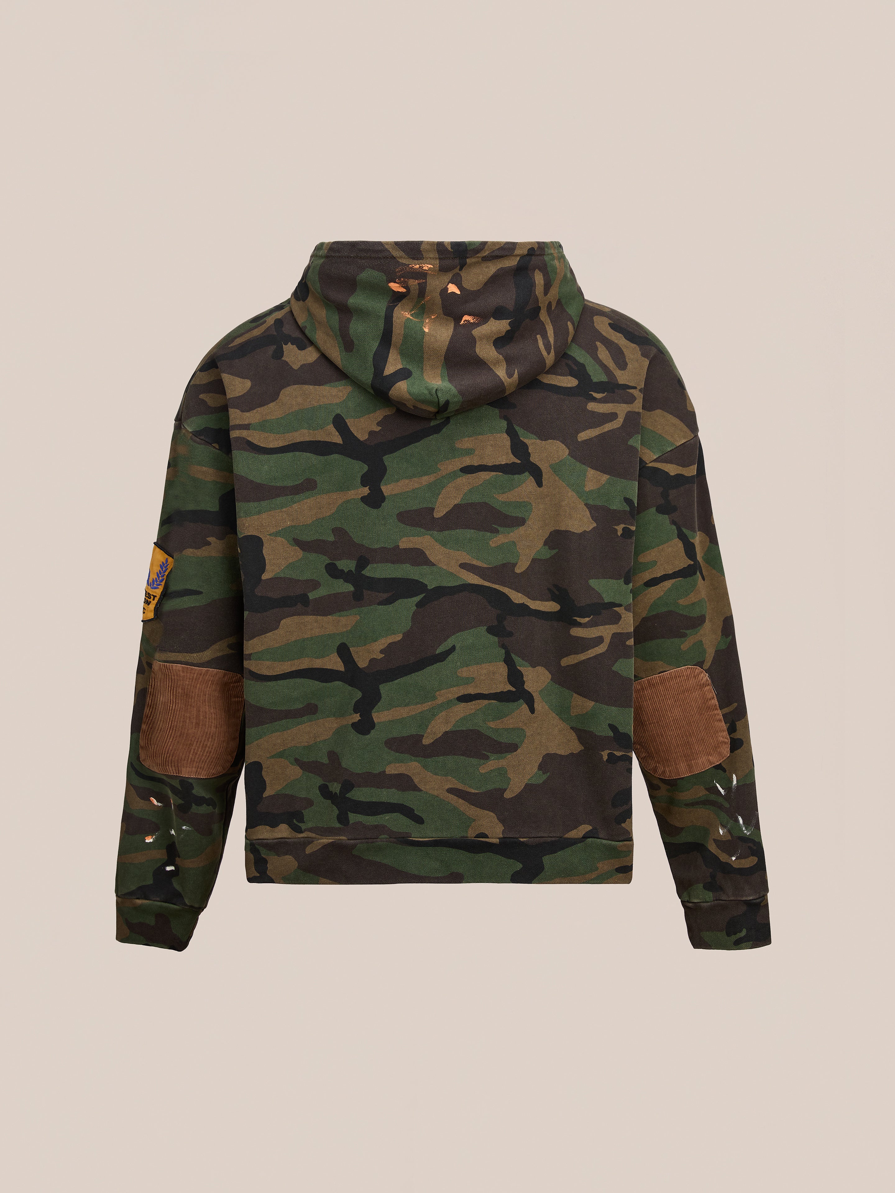 The FOUND Patch Camo Zip Up Hoodie is a relaxed fit unisex jacket with brown elbow patches and a left sleeve patch, shown from the back against a plain background.