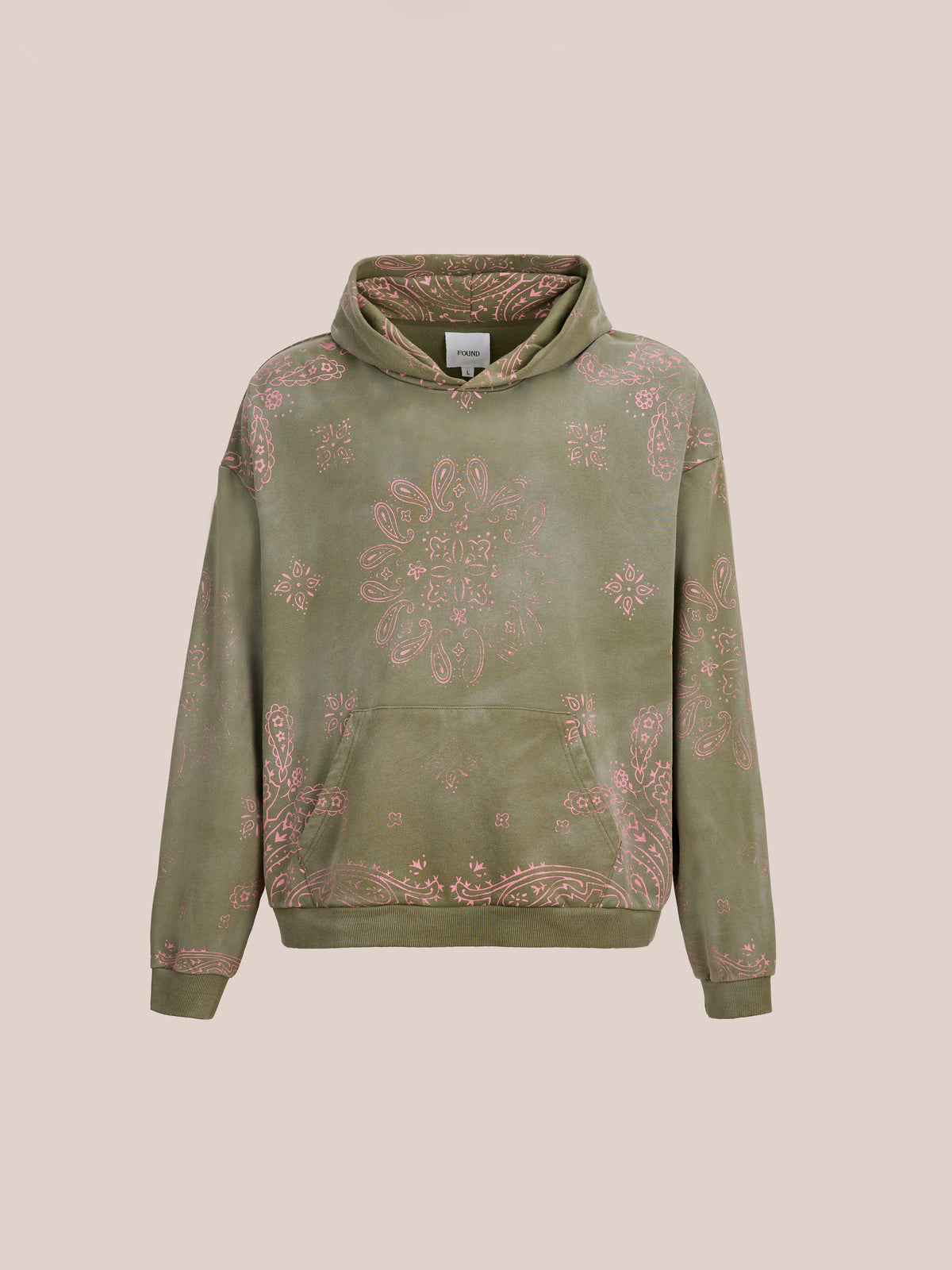 The FOUND Printed Paisley Hoodie features olive green, pink paisley, and floral prints—an eye-catching unisex pullover shown on a beige background.