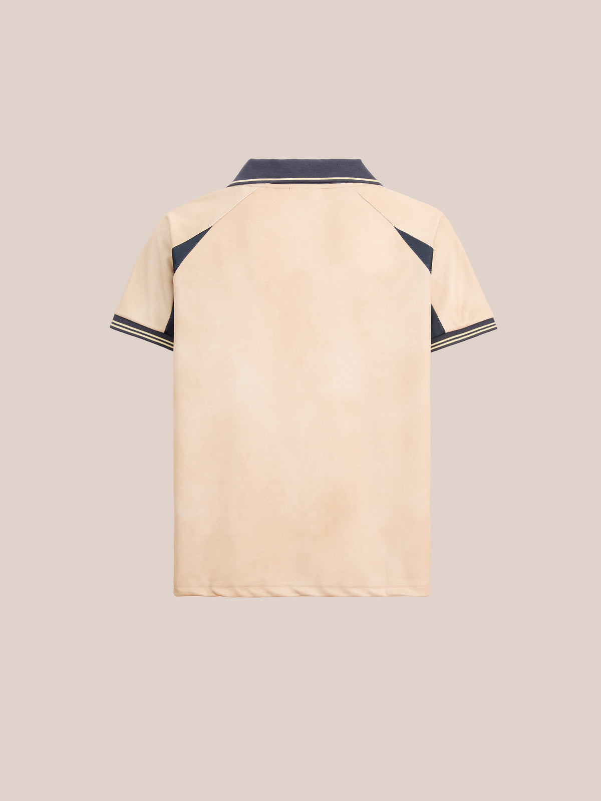 The Rosewood Jersey by FOUND is a beige short-sleeve polo shirt featuring a black collar, black shoulder accents, and black stripe detailing on the sleeve cuffs. Displayed from the back against a plain background, this versatile unisex sportswear piece evokes the timeless style of classic football jerseys while delivering everyday comfort.