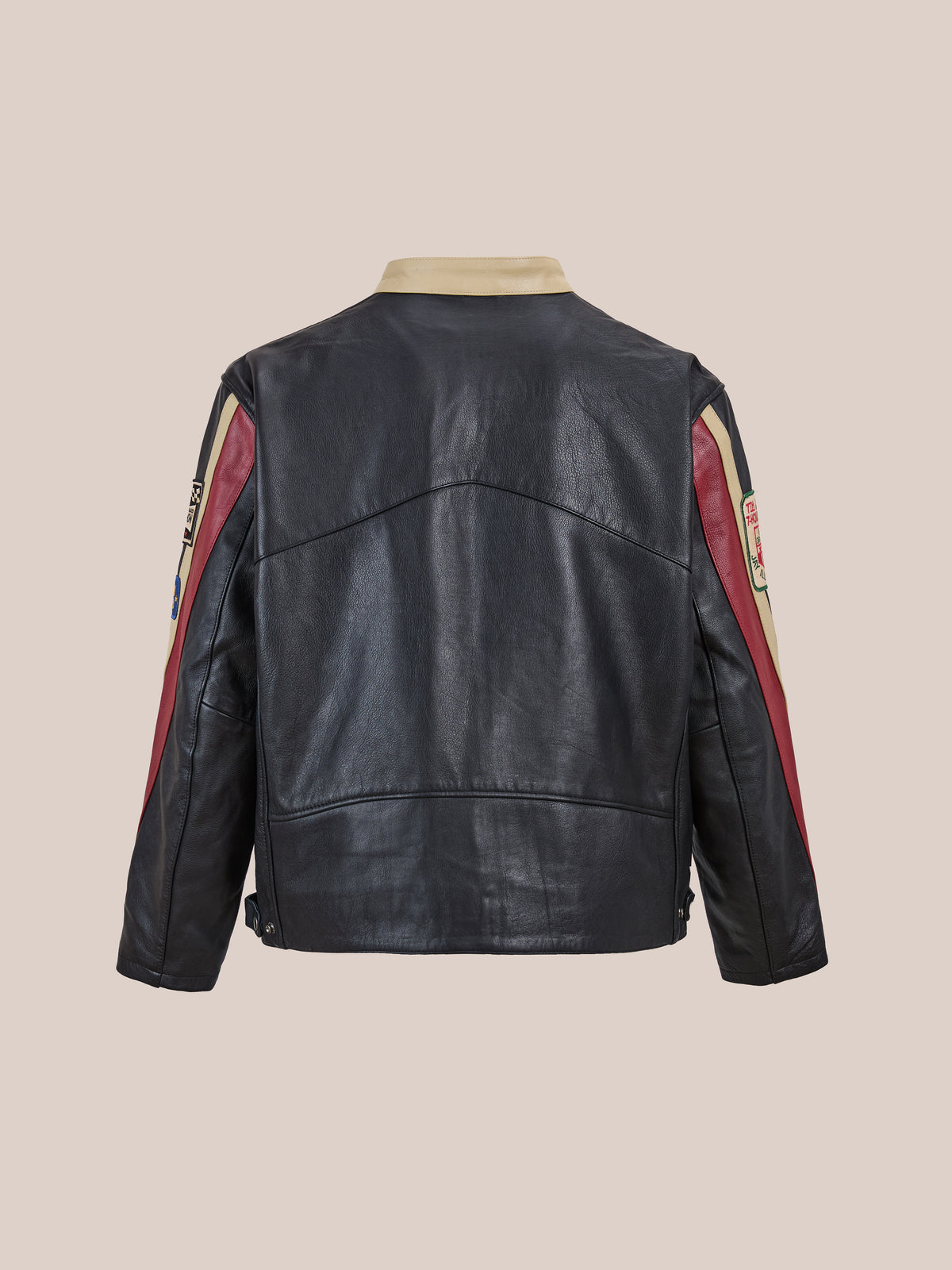 The FOUND Sport Racer Jacket in black cowhide features red and beige accents, displayed from the back on a plain beige background.