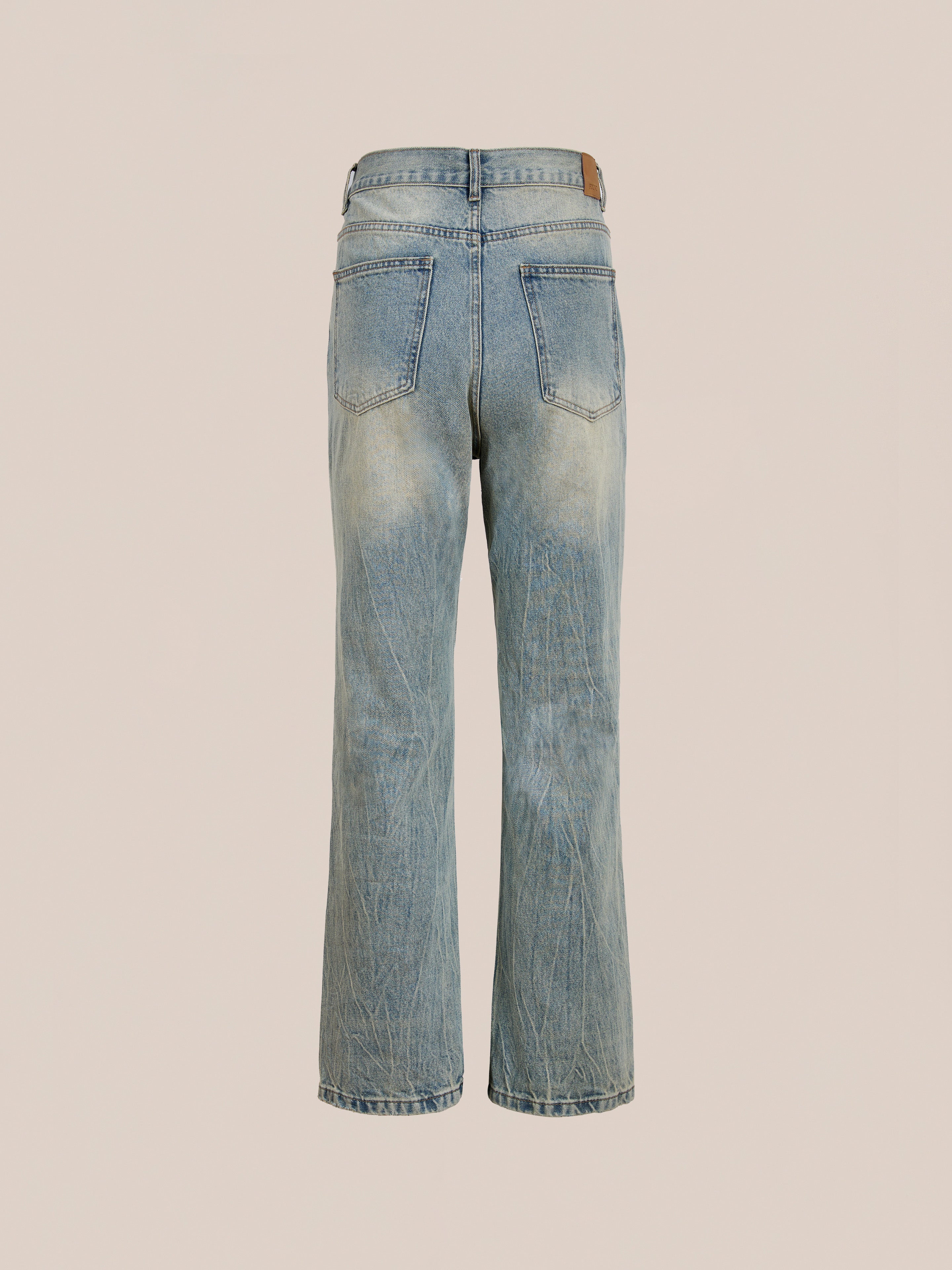 The Found Straight Leg Jeans feature a classic back view with two pockets and a subtly faded, worn look highlighted by visible creases.