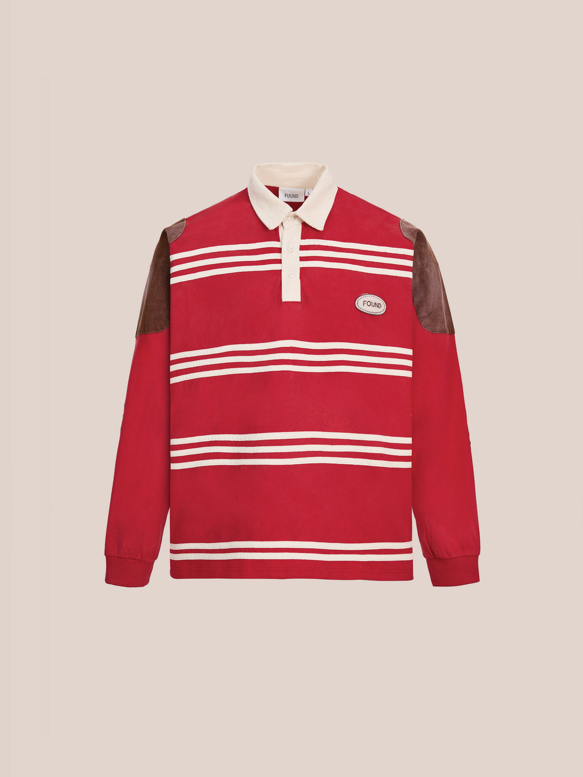 The FOUND Striped Corduroy Rugby Polo is a unisex relaxed-fit long-sleeve shirt in red, made from midweight cotton with white horizontal stripes, featuring a crisp white collar, button placket, brown shoulder patches, and a small oval logo on the chest.