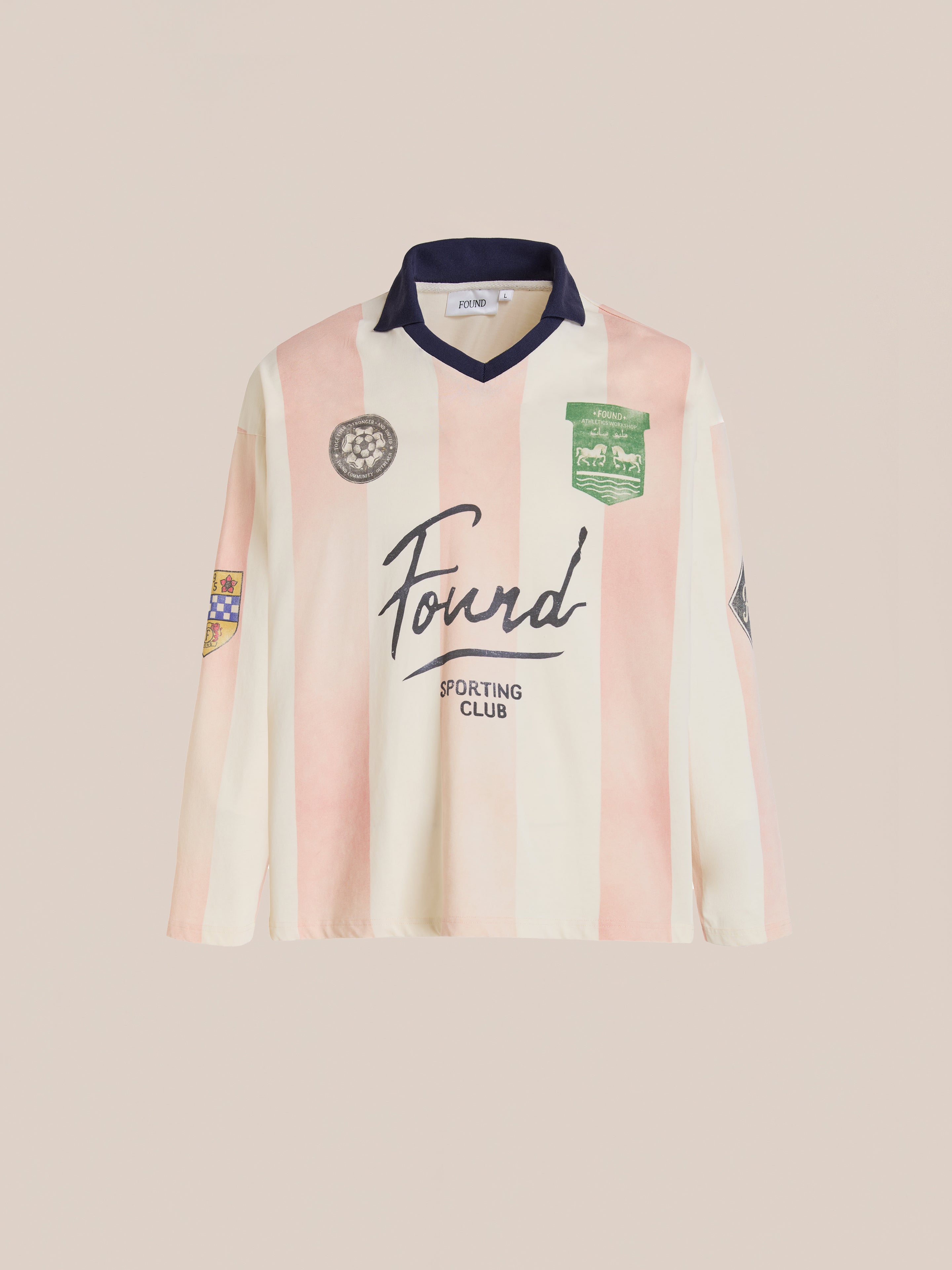 A pink and white Striped Sport LS Jersey by FOUND, featuring long sleeves, a relaxed unisex fit, multiple patches, and the "Found Sporting Club" logo on the front, shown against a plain background.