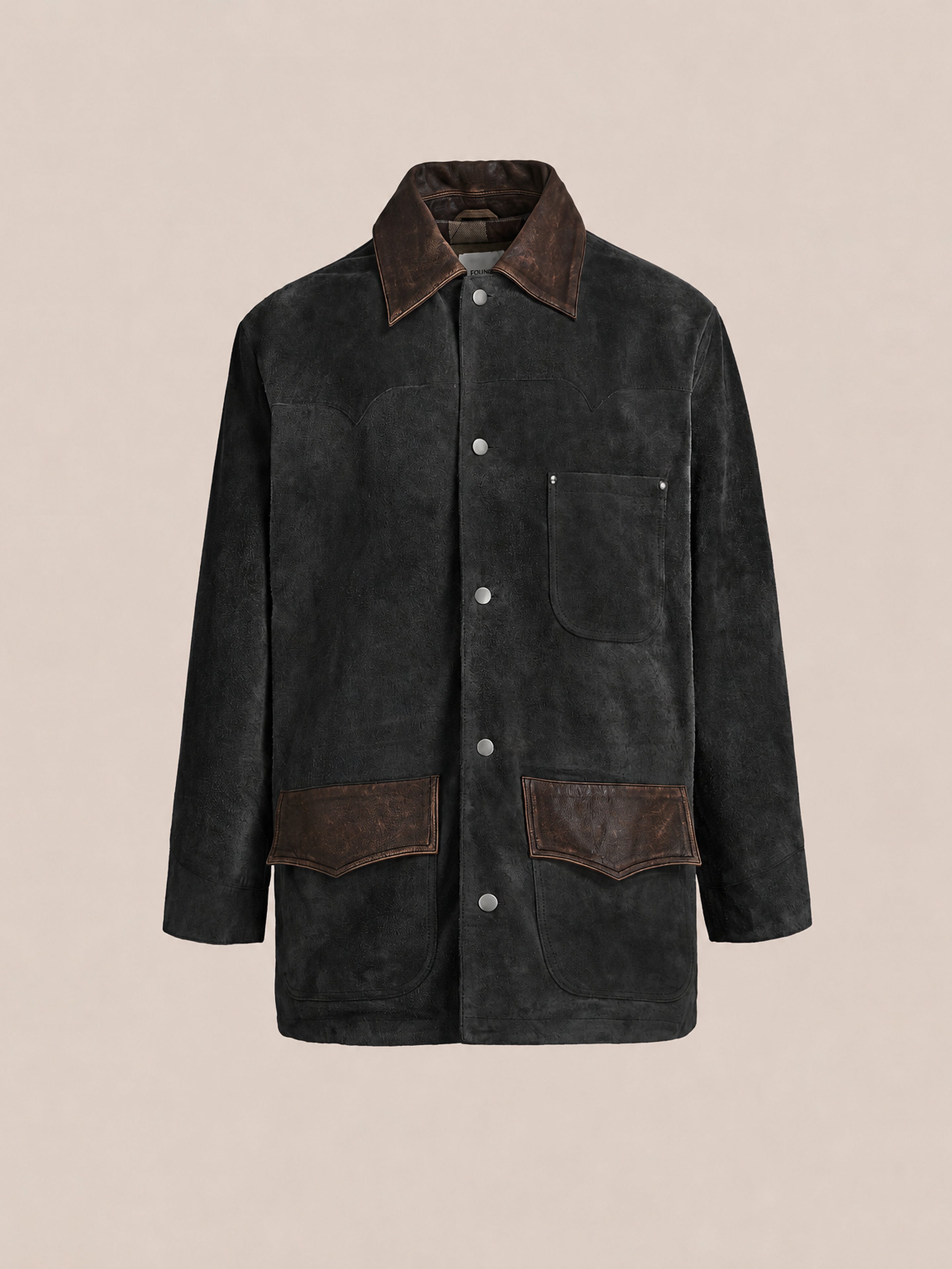 FOUND’s Suede Contrast Barn Jacket features dark suede with long sleeves, snap buttons, a brown collar, and large brown pockets, shown against a plain, light background.