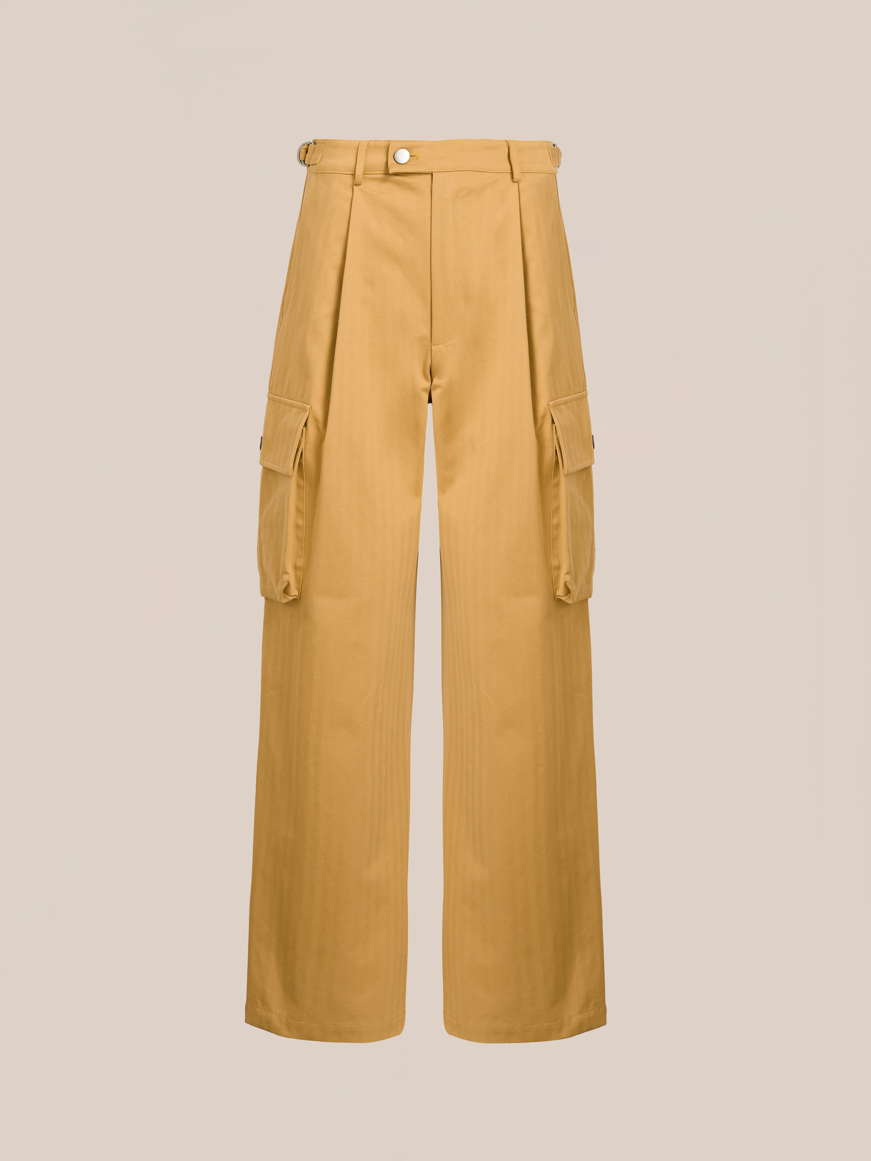 The Sunlight Twill Cargo Pants by FOUND are yellow, high-waisted, and relaxed fit. They feature side pockets, a button closure, and pleats, shown on a neutral background.