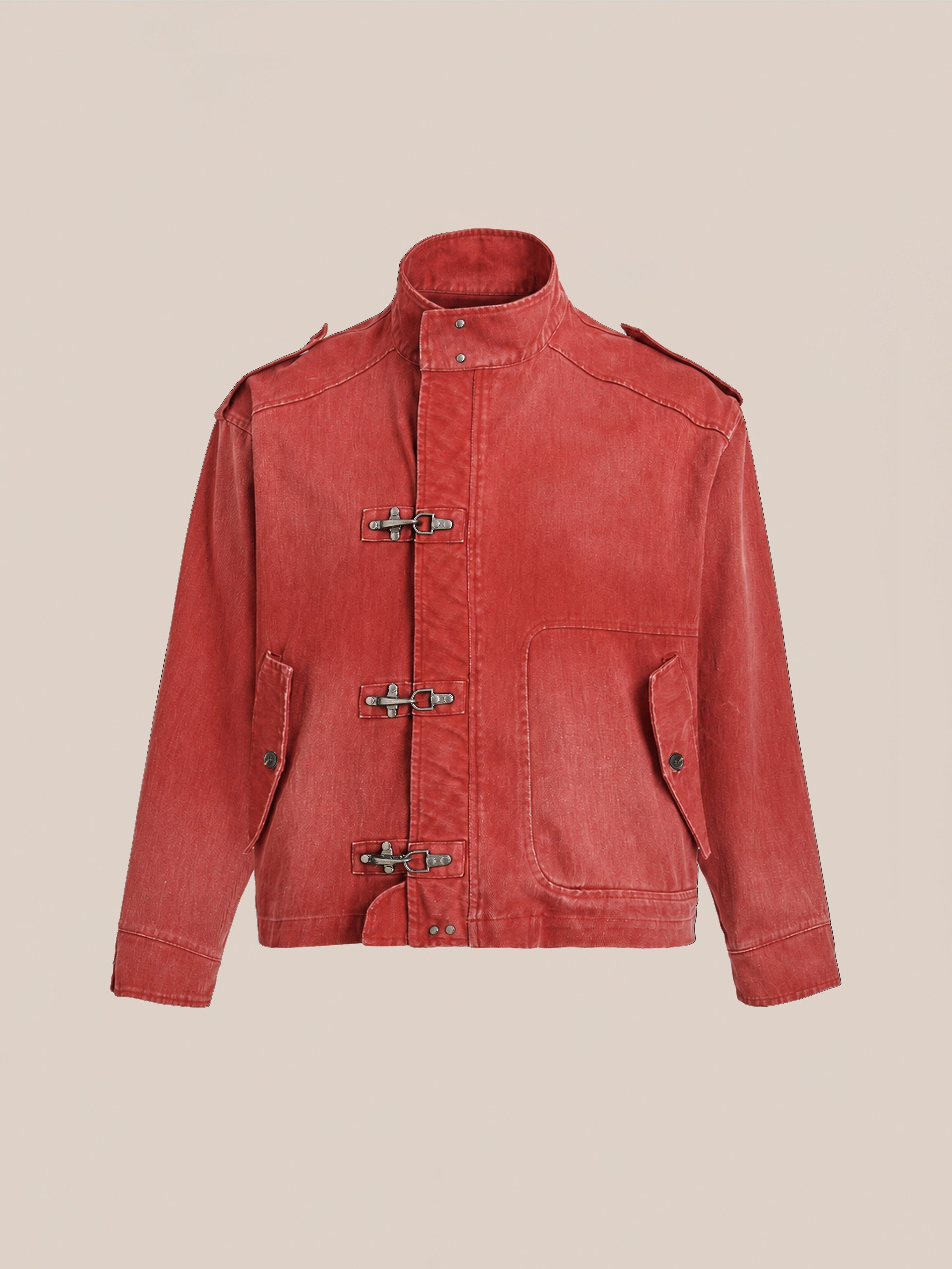 FOUND Utility Clasp Work Jacket in vintage red, featuring a high collar, three front fireman clasp closures, two spacious front pockets, buttoned cuffs, and shoulder epaulettes, shown against a plain beige background.