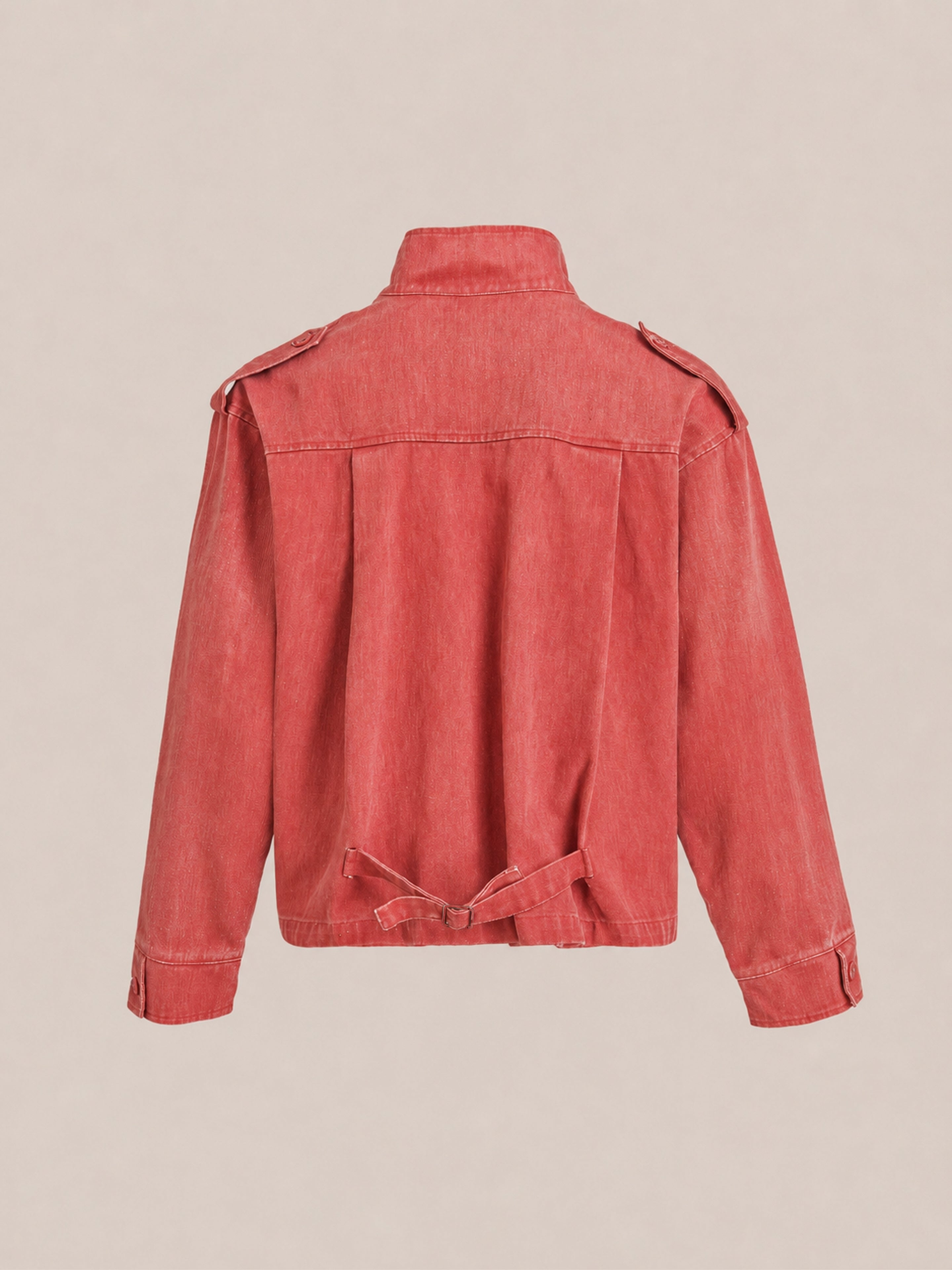 Back view of the FOUND Utility Clasp Work Jacket in vintage red, featuring long sleeves, shoulder epaulets, and an adjustable waist strap, displayed against a plain light background.