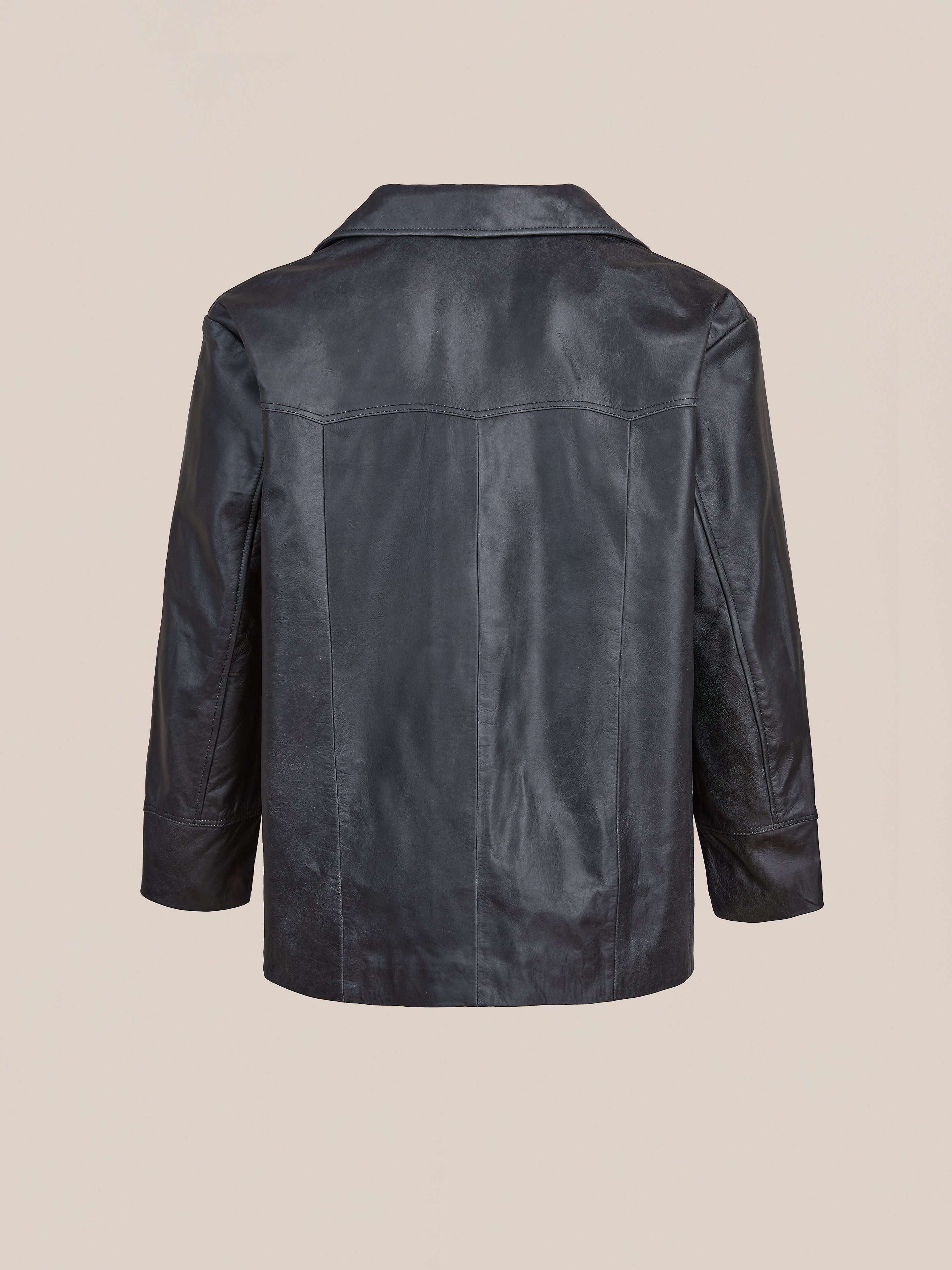The FOUND Western Oversized Leather Blazer is showcased from the back against a plain beige background.