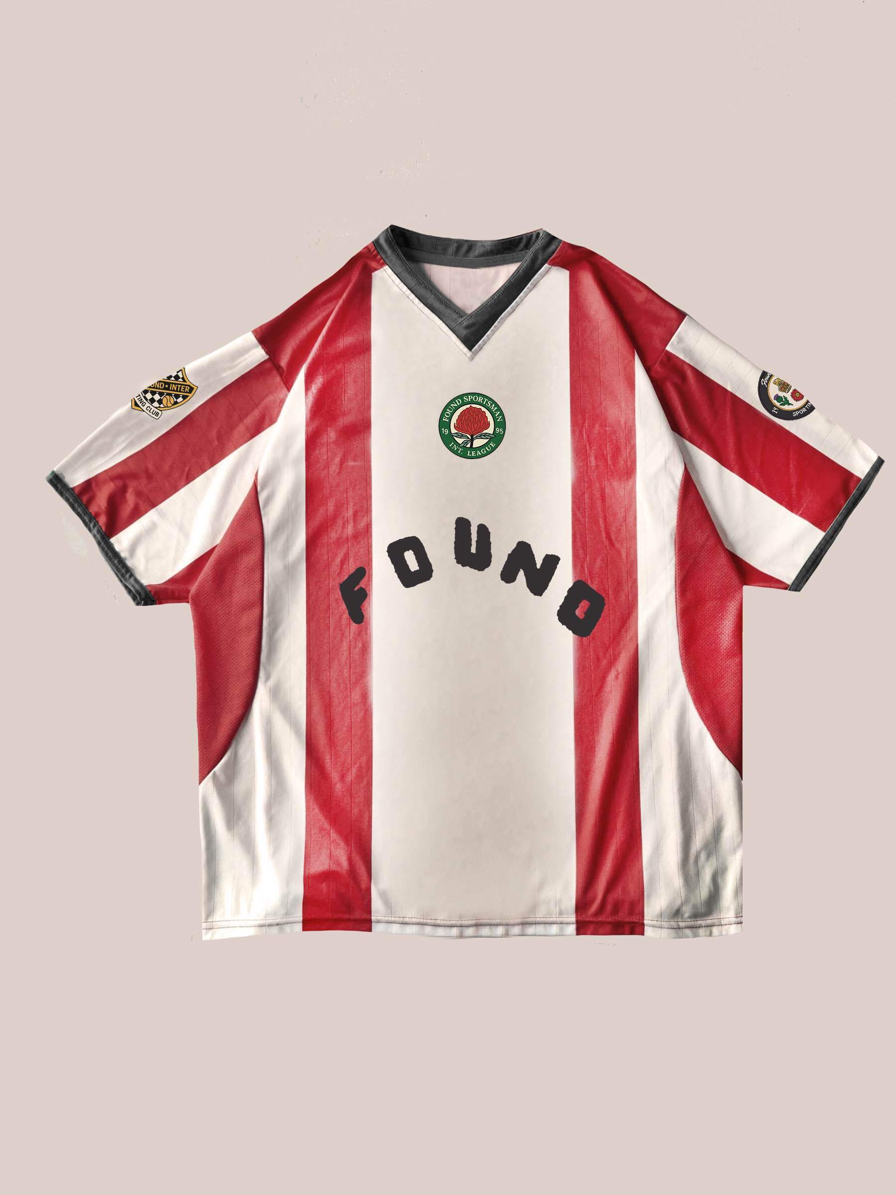 The FOUND Striped Stateman Jersey features bold red and white stripes, black trim, a green chest patch, "FOUND" text, and two sleeve logo patches—an eye-catching unisex sportswear piece shown on a light background.