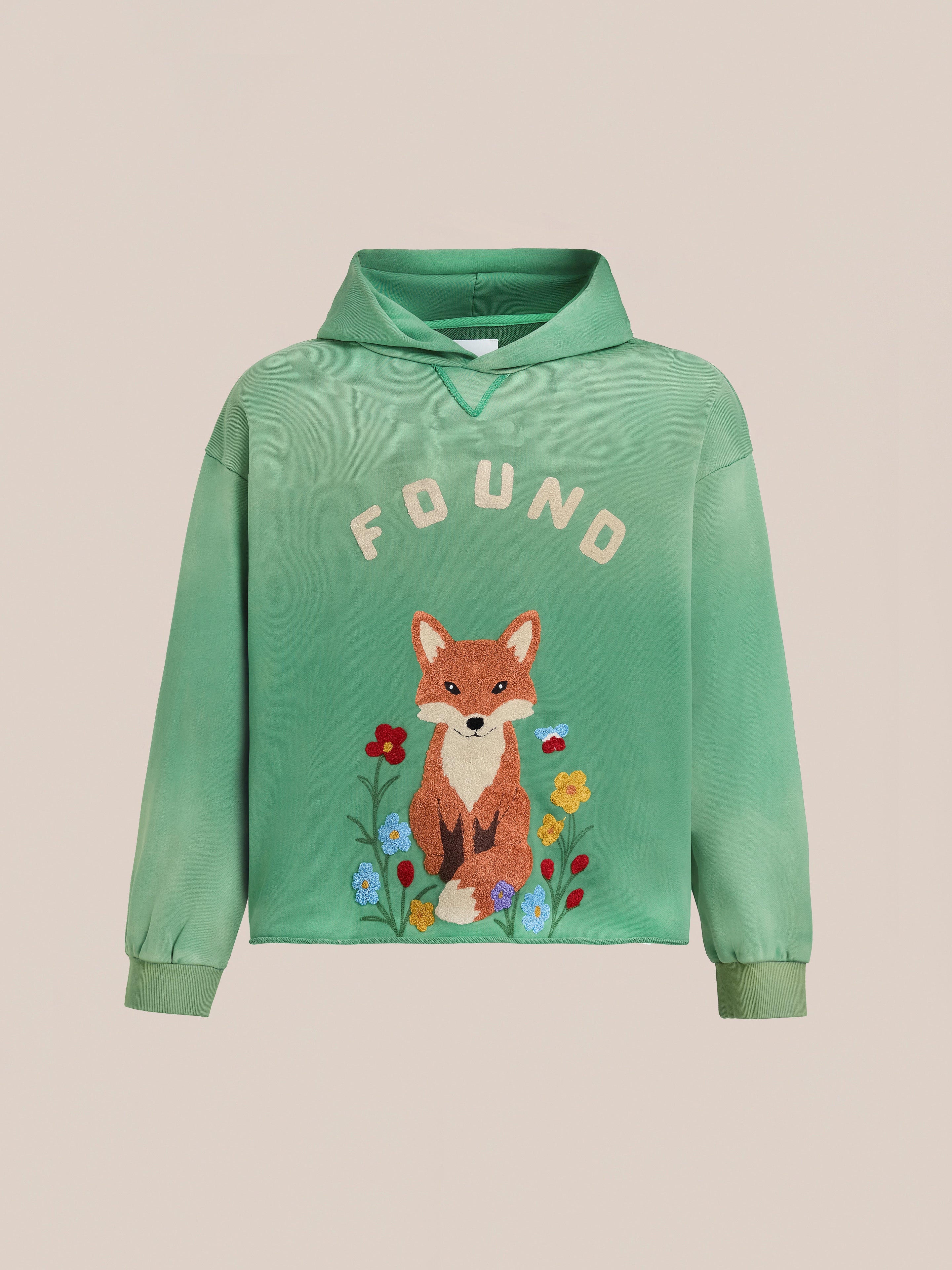 The Embroidered Wildlife Hoodie by FOUND features a green French-terry cotton design with "FOUND" text and a colorful embroidered fox among flowers—perfect for nature lovers.