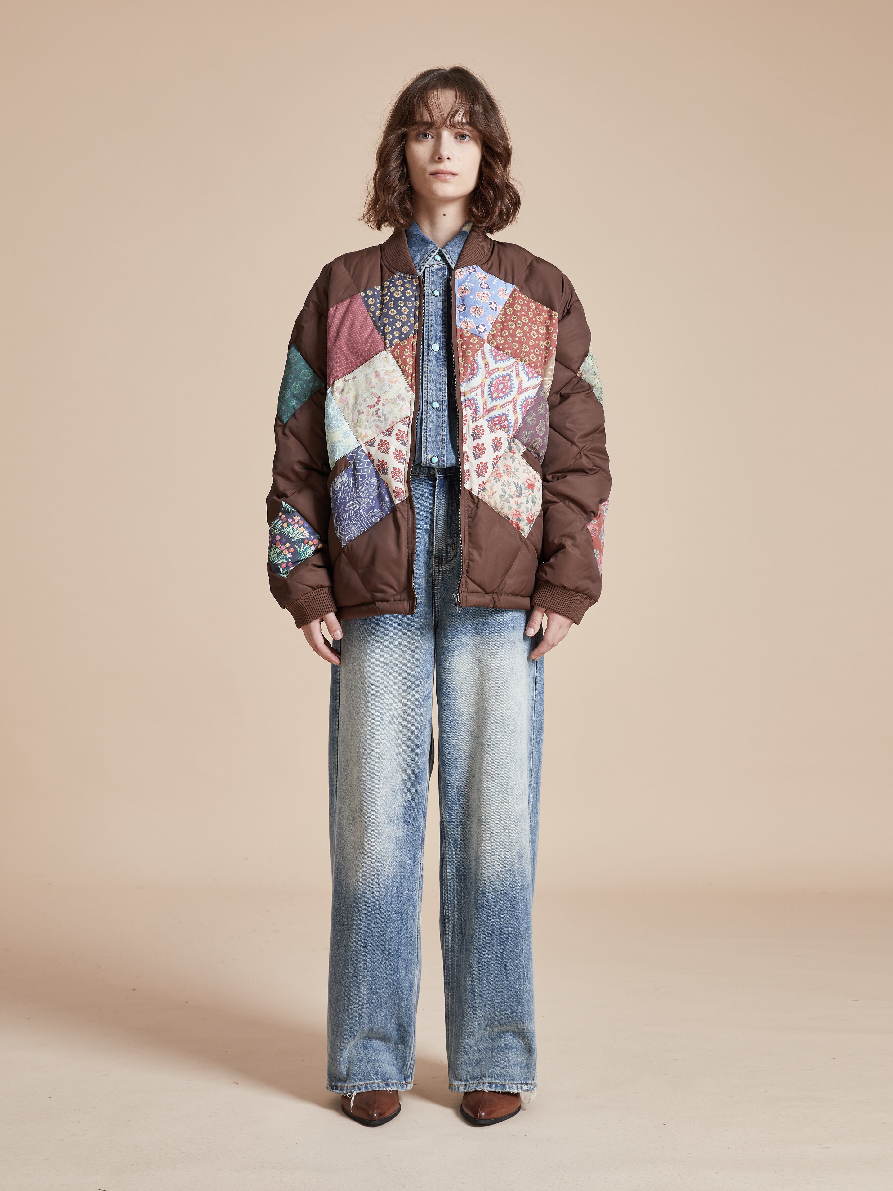 A woman wearing a Found Diamond Quilt Patchwork Jacket.